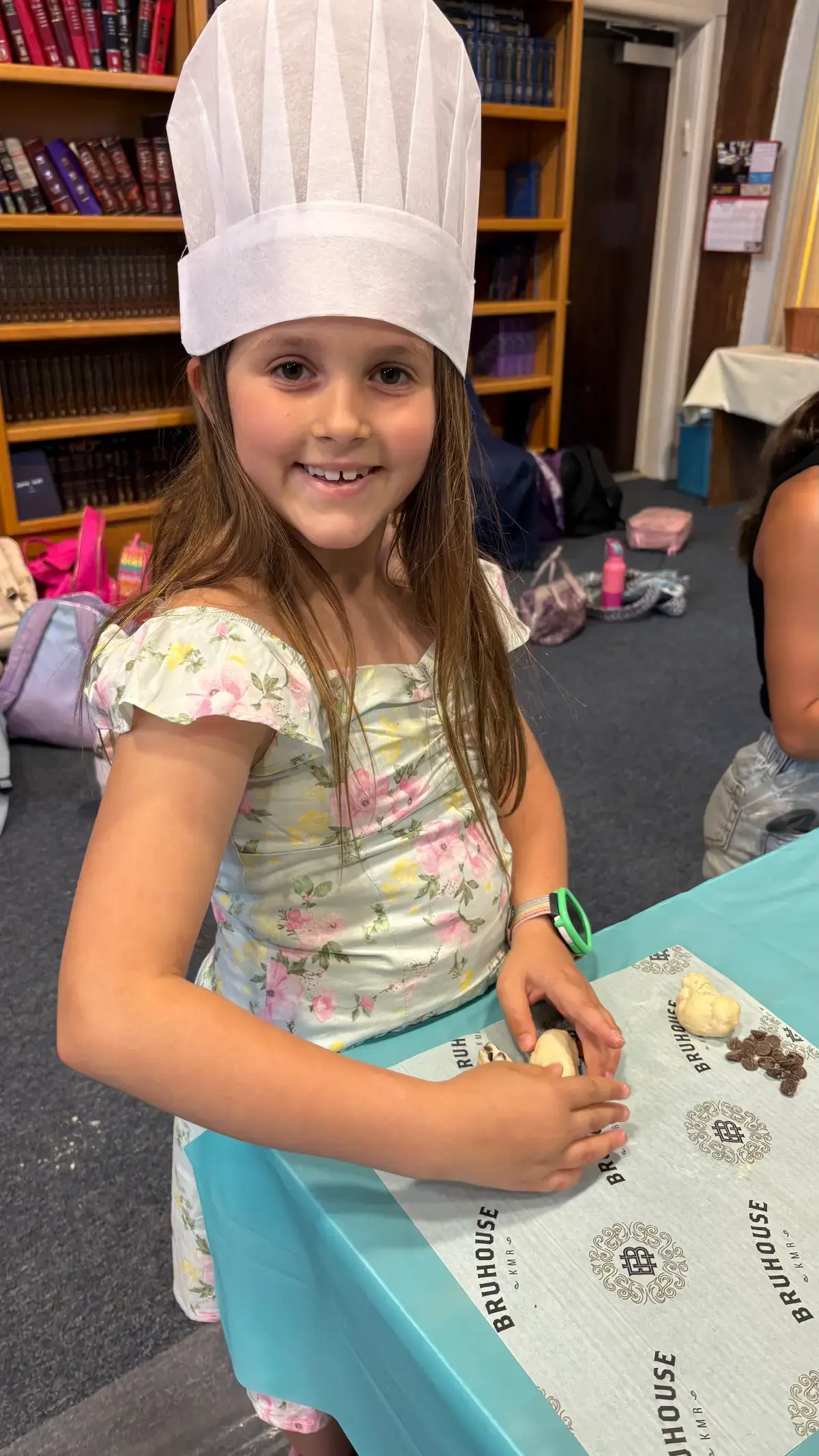 Camper smiling over her painting project
